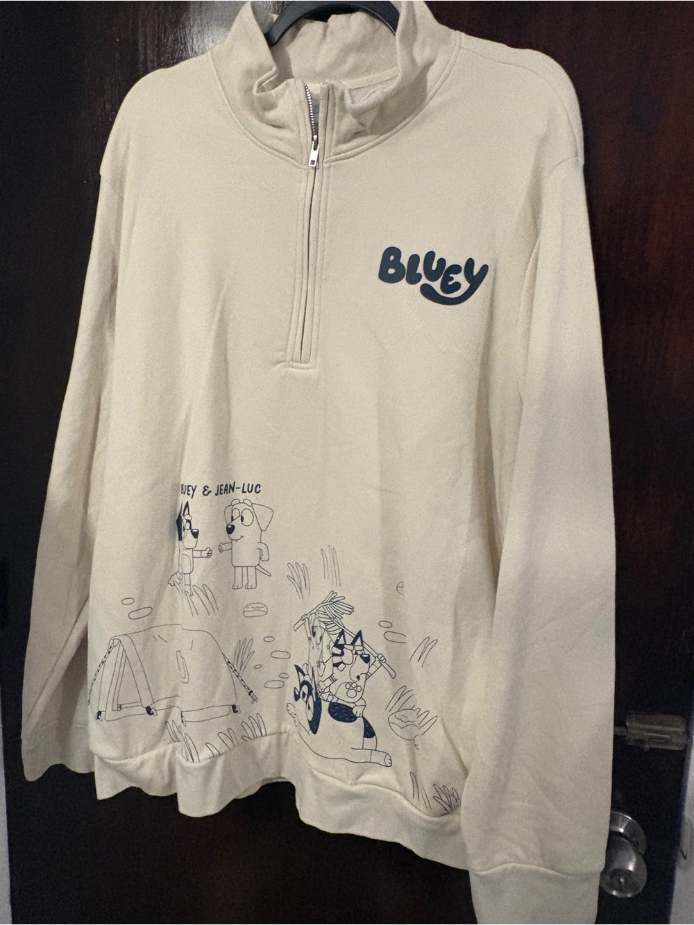 Bluey Cream Quarter-Zip Hoodie with Navy Camp Graphic. Size XXL.